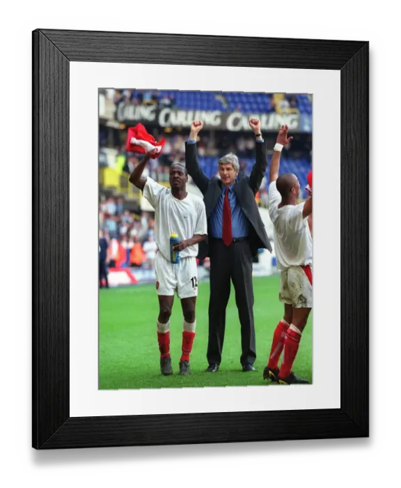 Framed Print : Arsene Wenger and Lauren celebrate at the end of the match Framed Print : Arsene Wenger and Lauren celebrate at the end of the match