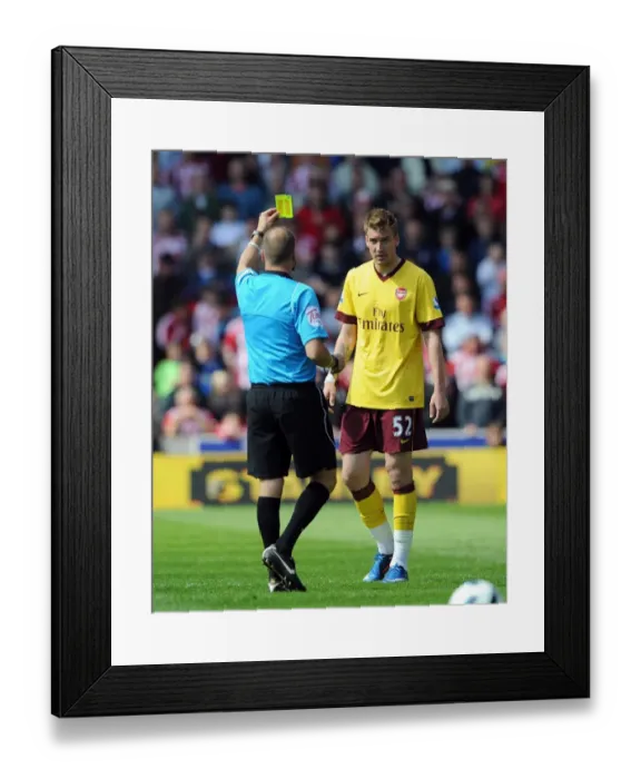 Framed Print : Nicklas Bendtner (Arsenal) is shown the yellow card. Stoke City 3: 1 Arsenal