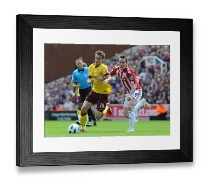 Framed Print : Aaron Ramsey (Arsenal) Dean Whitehead (Stoke). Stoke City 3: 1 Arsenal. Barclays Premier League Framed Print : Aaron Ramsey (Arsenal) Dean Whitehead (Stoke). Stoke City 3: 1 Arsenal. Barclays Premier League