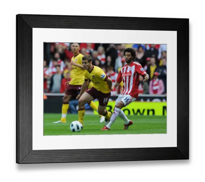 Framed Print : Jack Wilshere vs Jermaine Pennant: Stoke City's Triumph Over Arsenal in the Premier League (8 / 5 / 2011)