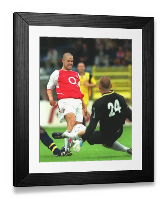 Framed Print : Graham Barrett shoots past Beveren goalkeeper Graham Stack to score the Arsenal goal Framed Print : Graham Barrett shoots past Beveren goalkeeper Graham Stack to score the Arsenal goal