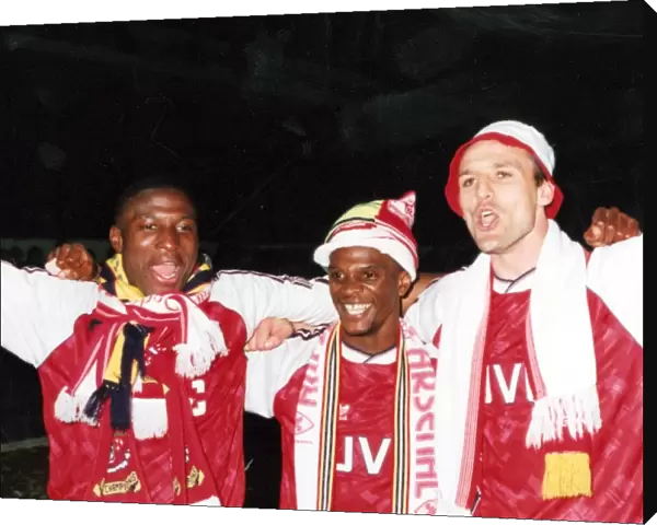 Kevin Campbell, Paul Davis and Steve Bould celebrate winning the League Championship