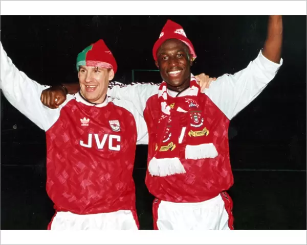 Paul Merson and Kevin Campbell celebrate winning the League Championship