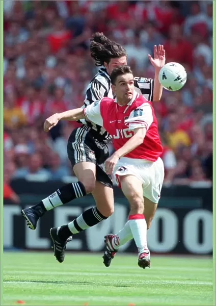 Marc Overmars bursts past the Newacastle defender on his way to scoring the 1st Arsenal Goal