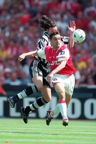 Marc Overmars bursts past the Newacastle defender on his way to scoring the 1st Arsenal Goal