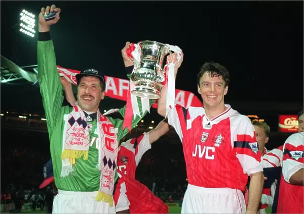 David Seaman and David O Leary hold aloft the FA Cup Trophy after the game