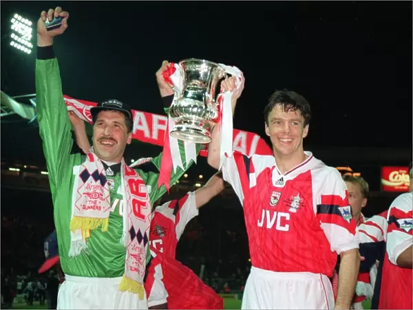 David Seaman and David O Leary hold aloft the FA Cup Trophy after the game
