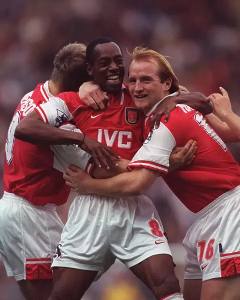 Ian Wright celebrates scoring for Arsenal with John Hartson and Paul Merson