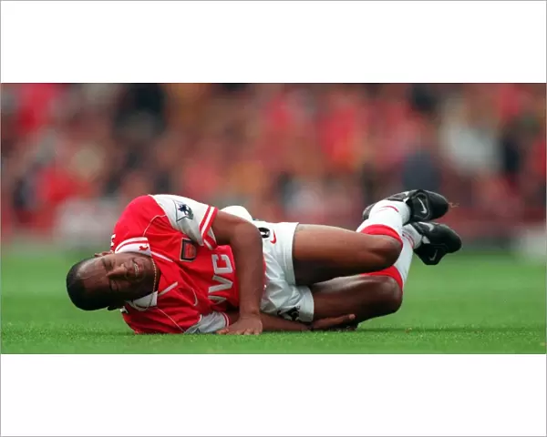 Ian Wright (Arsenal) on the floor injured