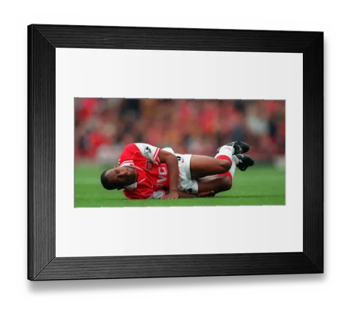 Framed Print : Ian Wright (Arsenal) on the floor injured