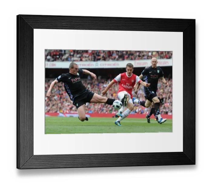 Framed Print : Aaron Ramsey (Arsenal) Richard Dunne (Aston Villa). Arsenal 1: 2 Aston Villa Framed Print : Aaron Ramsey (Arsenal) Richard Dunne (Aston Villa). Arsenal 1: 2 Aston Villa
