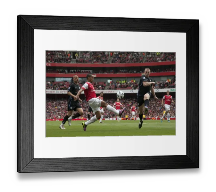 Framed Print : Theo Walcott (Arsenal) Richard Dunne (Villa). Arsenal 1: 2 Aston Villa. Barclays Premier League Framed Print : Theo Walcott (Arsenal) Richard Dunne (Villa). Arsenal 1: 2 Aston Villa. Barclays Premier League