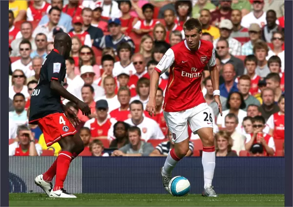 Nicklas Bendtner (Arsenal) Youssuf Mulumbu (PSG)