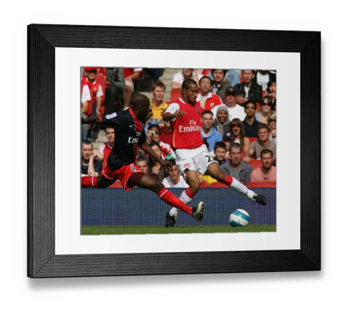 Framed Print : Clash of Titans: Arsenal's Gael Clichy vs. Paris Saint-Germain's Youssuf Mulumbu - Arsenal's 2:1 Victory in Emirates Cup, Day One