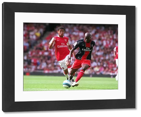 Denilson (Arsenal) Youssuf Mulumbu (PSG)