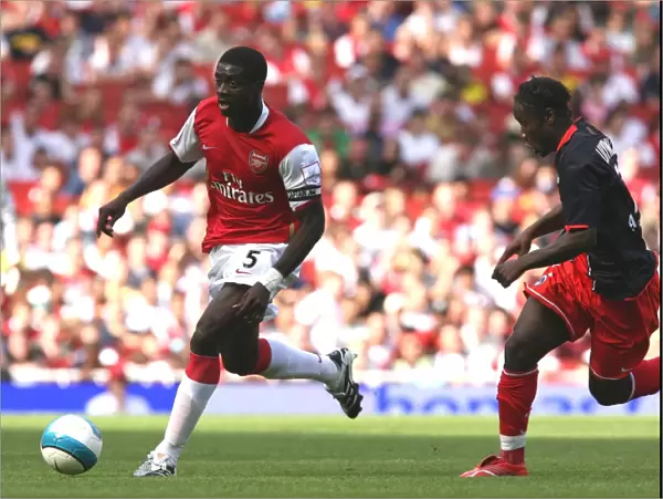 Kolo Toure (Arsenal) Peguy Luyindula (PSG)