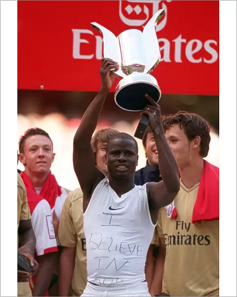 Emmanuel Eboue (Arsenal) with the Emirates Cup