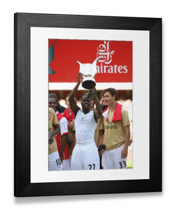 Framed Print : Emmauel Eboue (Arsenal) with the Emirates Trophy