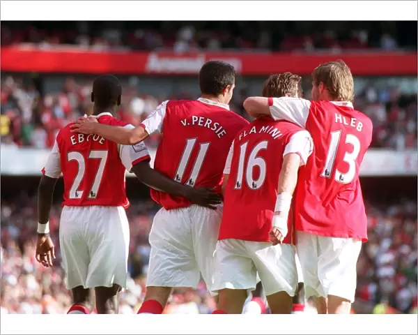 Robin van Persie celebrates scoring Arsenals 2nd goal with Emmanuel Eboue