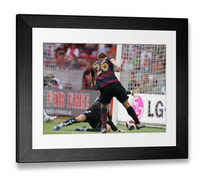 Framed Print : Bendtner's Stunner: Arsenal's First Goal Against Lazio in Amsterdam Tournament