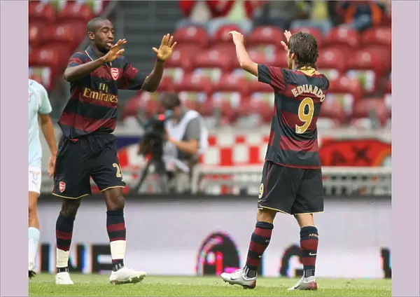 Eduardo celebrates scoring the 2nd Arsenal goal with Johan Djourou