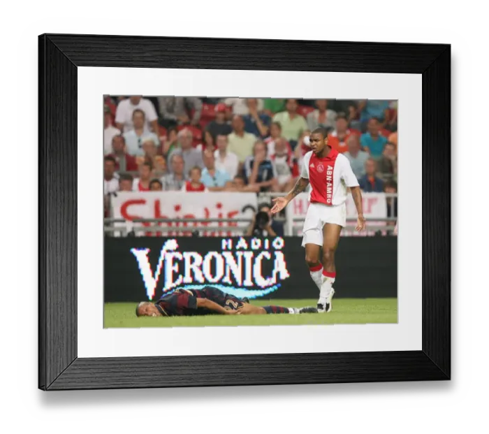 Framed Print : Injured Gael Clichy (Arsenal) and Ajax defender Colin Framed Print : Injured Gael Clichy (Arsenal) and Ajax defender Colin