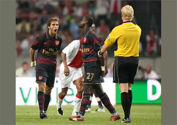Mathieu Flamini (Arsenal) argues with the referee