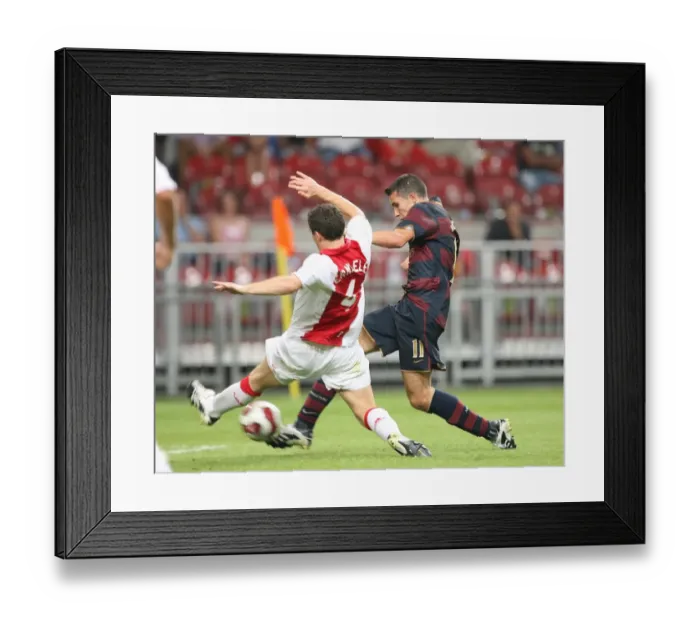 Framed Print : Robin van Persie shoots past Thomas Vermaelen to score the Arsenal goal Framed Print : Robin van Persie shoots past Thomas Vermaelen to score the Arsenal goal