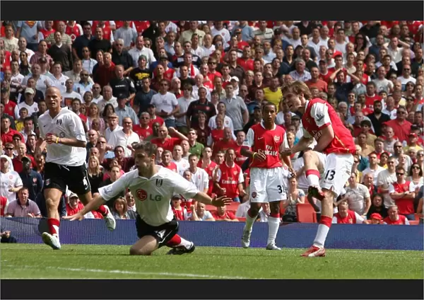 Alex Hleb shoots past Fulham defender Chris Baird to score the 2nd Arsenal goal