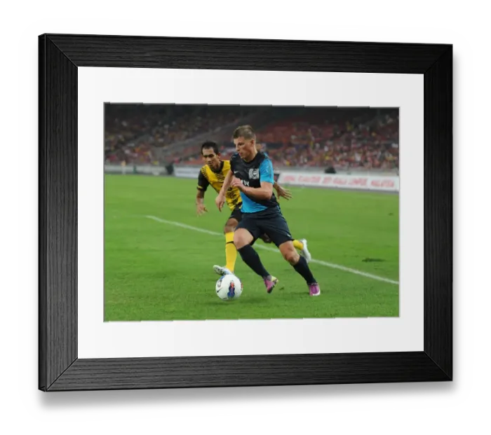 Framed Print : Andrey Arshavin (Arsenal) Helmi Remeli (Malaysia). Malaysia XI 0: 4 Arsenal