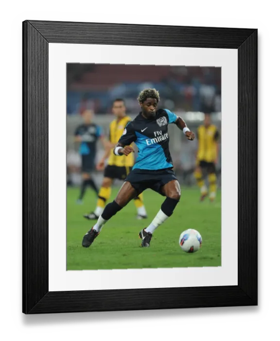 Framed Print : Alex Song's Dominance: Arsenal Crushes Malaysia XI 4-0 at Bukit Jalil Stadium Framed Print : Alex Song's Dominance: Arsenal Crushes Malaysia XI 4-0 at Bukit Jalil Stadium