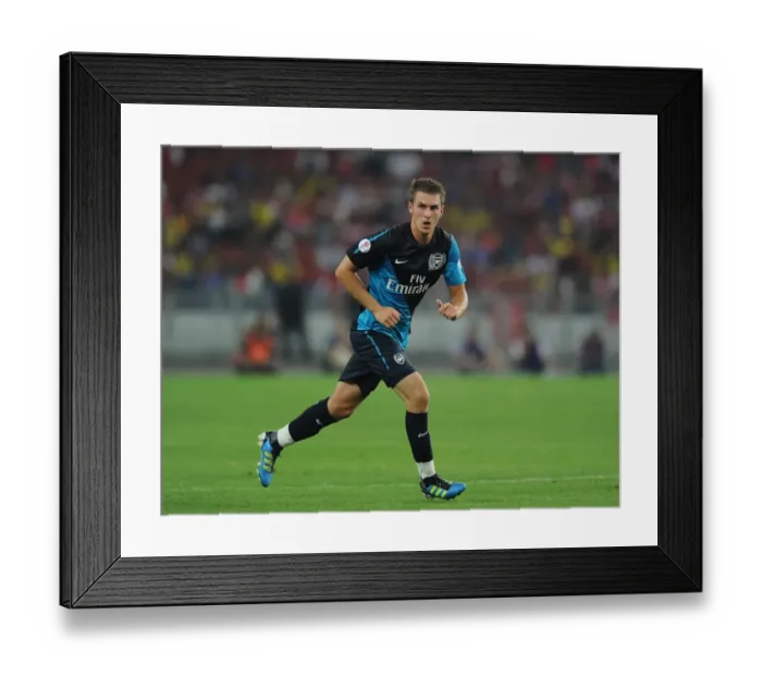 Framed Print : Aaron Ramsey's Hat-Trick: Arsenal Crushes Malaysia XI 4-0 at Bukit Jalil Stadium Framed Print : Aaron Ramsey's Hat-Trick: Arsenal Crushes Malaysia XI 4-0 at Bukit Jalil Stadium