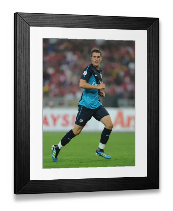 Framed Print : Arsenal's Aaron Ramsey Scores Hat-Trick in 4-0 Crushing of Malaysia XI at Bukit Jalil Stadium