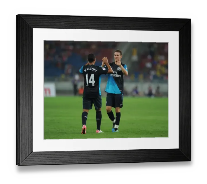 Framed Print : Theo Walcott celebrates scoring the 2nd Arsenal goal with Aaron Ramsey Framed Print : Theo Walcott celebrates scoring the 2nd Arsenal goal with Aaron Ramsey