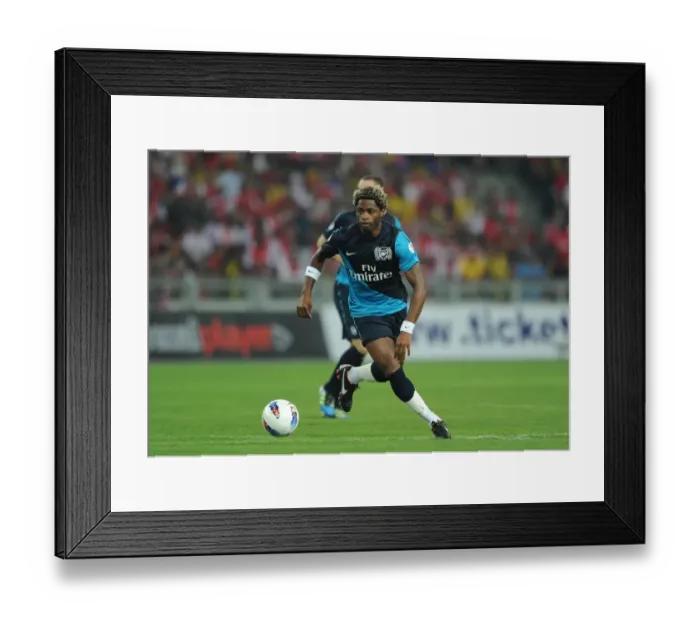 Framed Print : Alex Song's Dominant Display: Arsenal Routs Malaysia XI 4-0