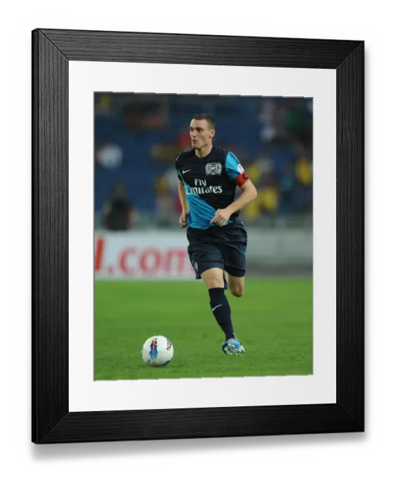 Framed Print : Thomas Vermaelen's Dominant Performance: Arsenal Crushes Malaysia XI 4-0 at Bukit Jalil Stadium