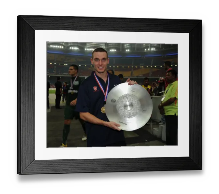 Framed Print : Thomas Vermaelen (Arsenal) with the winners trophy after the match. Malaysia XI 0: 4 Arsenal