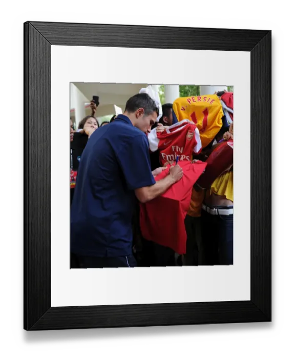 Framed Print : Robin van Persie signs autographs outside the hotel. Suajuna Hotel, Kuala Lumpur