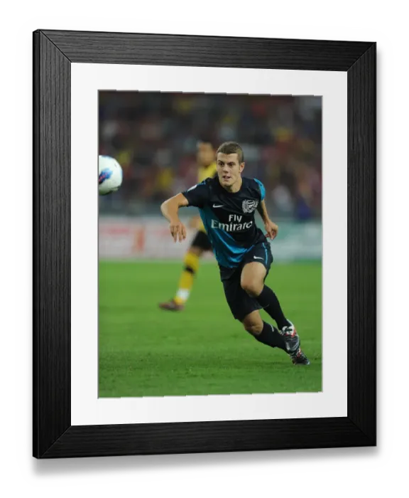 Framed Print : Jack Wilshere's Brilliant Performance: Arsenal Crushes Malaysia XI 4-0 at Bukit Jalil Stadium