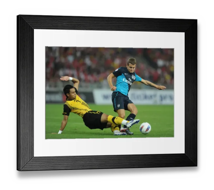 Framed Print : Jack Wilshere (Arsenal) Mohd Zafuan (Malaysia). Malaysia XI 0: 4 Arsenal Framed Print : Jack Wilshere (Arsenal) Mohd Zafuan (Malaysia). Malaysia XI 0: 4 Arsenal