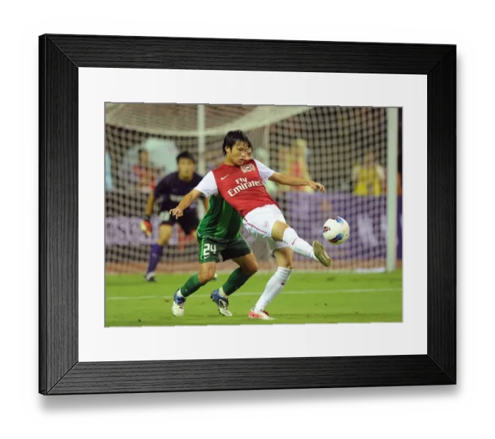 Framed Print : Clash of Stars: Miyaichi vs. Liu Bin (Hangzhou Greentown vs. Arsenal)