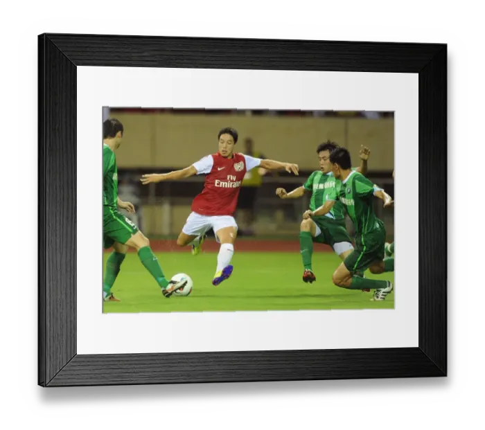 Framed Print : Samir Nasri Clashes with Hangzhou Greentown's Li Yan and Yang Zi during Arsenal's Pre-Season Match in China Framed Print : Samir Nasri Clashes with Hangzhou Greentown's Li Yan and Yang Zi during Arsenal's Pre-Season Match in China