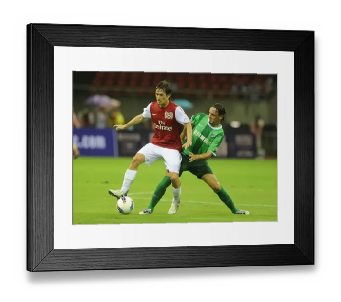 Framed Print : Arsenal's Tomas Rosicky Faces Off Against Vazquez in Hangzhou Friendly Framed Print : Arsenal's Tomas Rosicky Faces Off Against Vazquez in Hangzhou Friendly