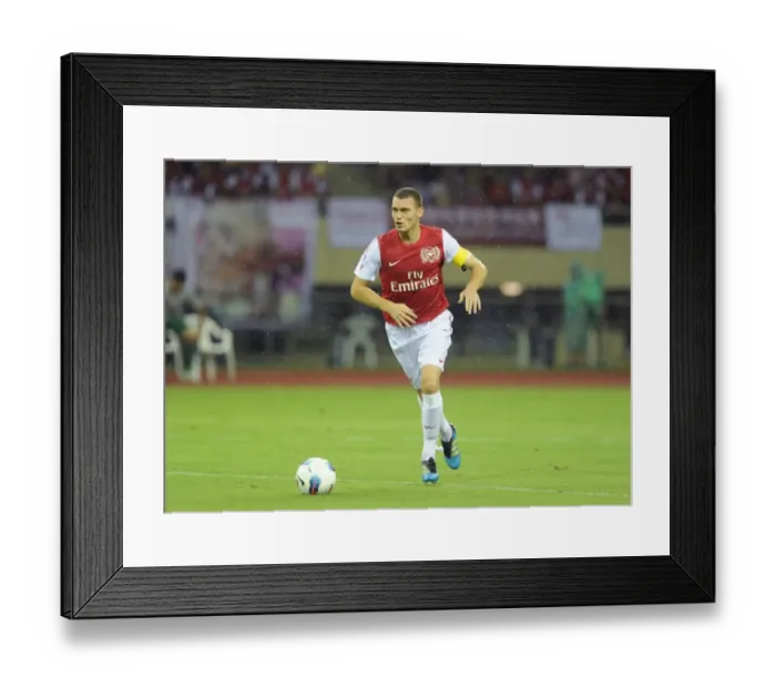 Framed Print : Thomas Vermaelen in Action: Arsenal's Pre-Season Clash with Hangzhou Greentown (2011)