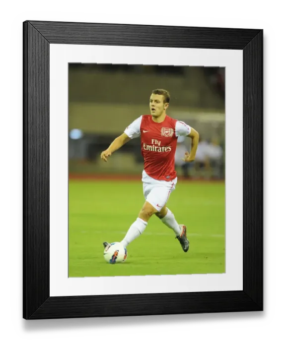 Framed Print : Jack Wilshere in Action: Arsenal vs Hangzhou Greentown (2011)