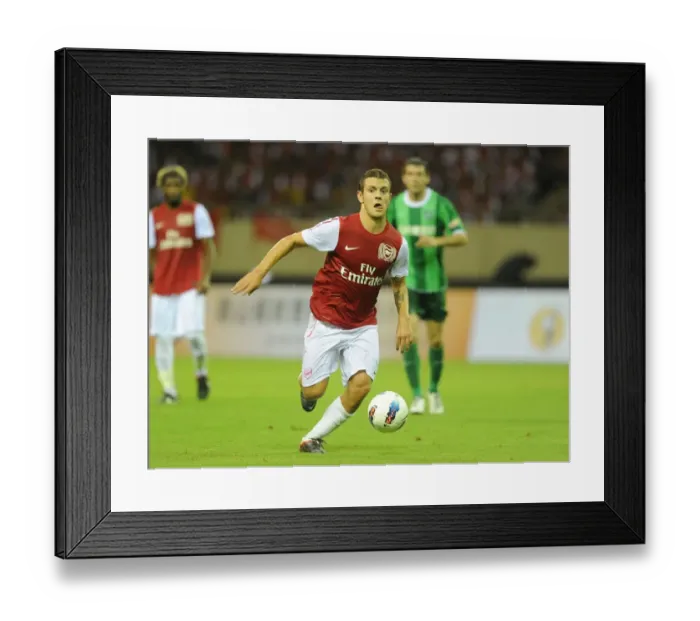 Framed Print : Jack Wilshere in Action: Arsenal's Star Midfielder Shines in Pre-Season Friendly against Hangzhou Greentown, China (2011) Framed Print : Jack Wilshere in Action: Arsenal's Star Midfielder Shines in Pre-Season Friendly against Hangzhou Greentown, China (2011)