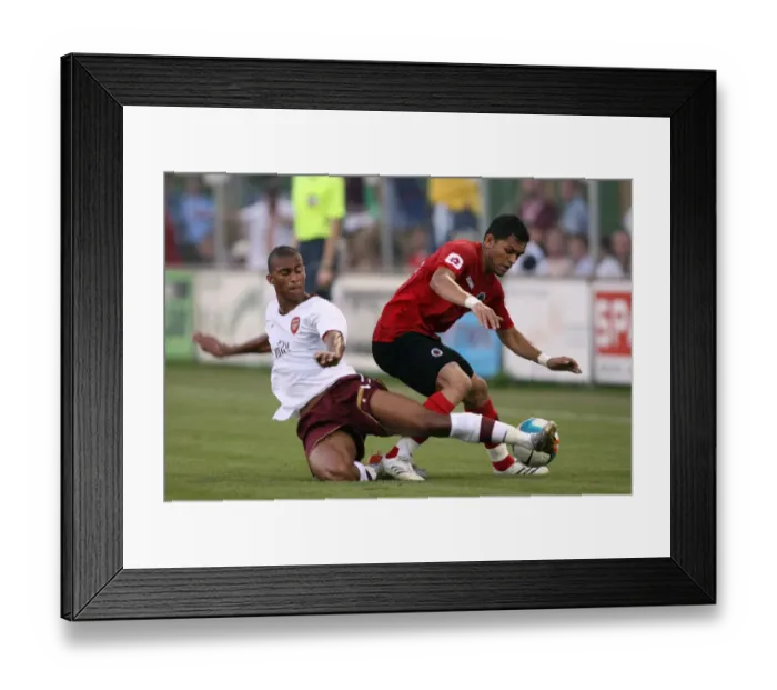Framed Print : Armand Traore (Arsenal) Sandro (Genclerbirligi) Framed Print : Armand Traore (Arsenal) Sandro (Genclerbirligi)