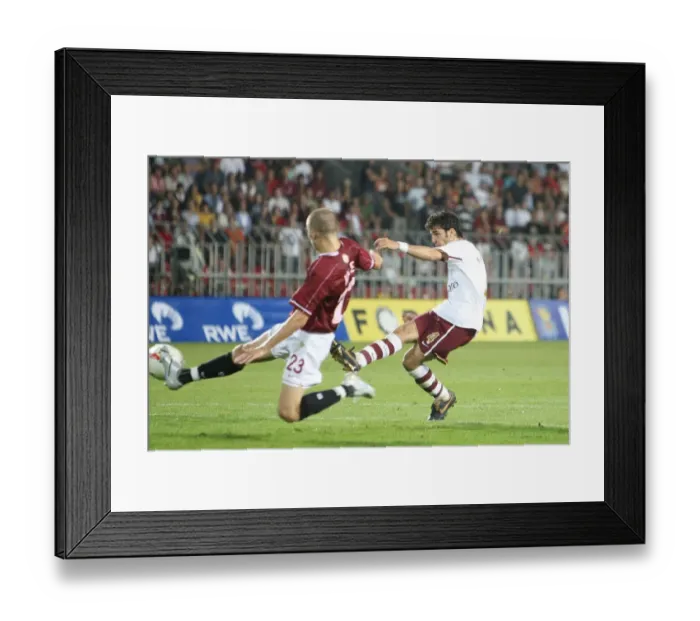 Framed Print : Cesc Fabregas shoots past Sparta goalkeeper Tomas Postulka to score the 1st Arsenal goal