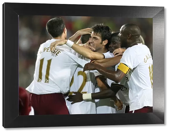 Celebrating Glory: Fabregas, Van Persie, and the Arsenal Team After Their Historic Goals Against Sparta Prague in the Champions League Qualifier (2007)