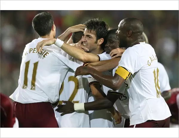 Celebrating Glory: Fabregas, Van Persie, and the Arsenal Team After Their Historic Goals Against Sparta Prague in the Champions League Qualifier (2007)